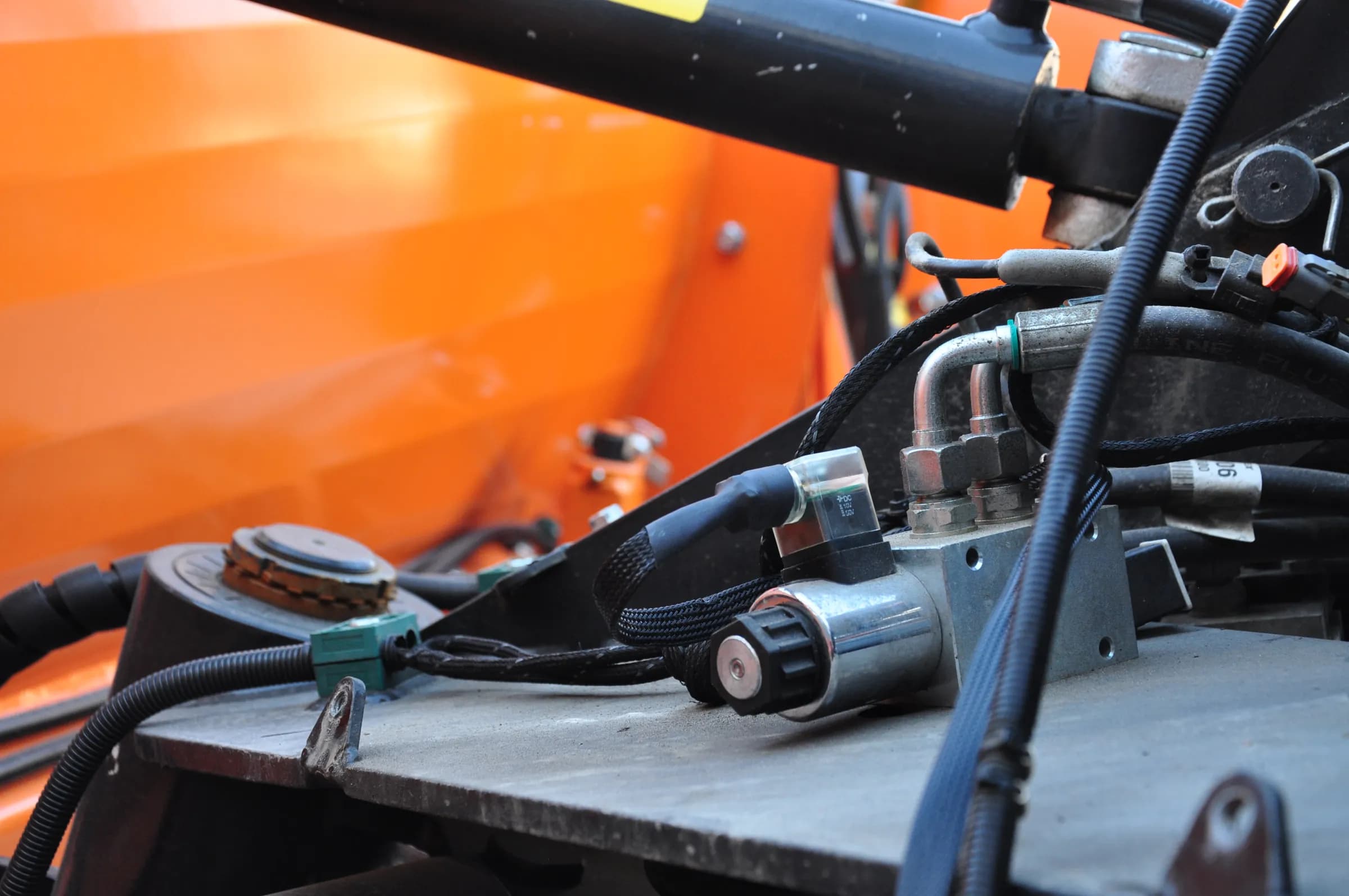 Solenoid valve on a snowplow implement